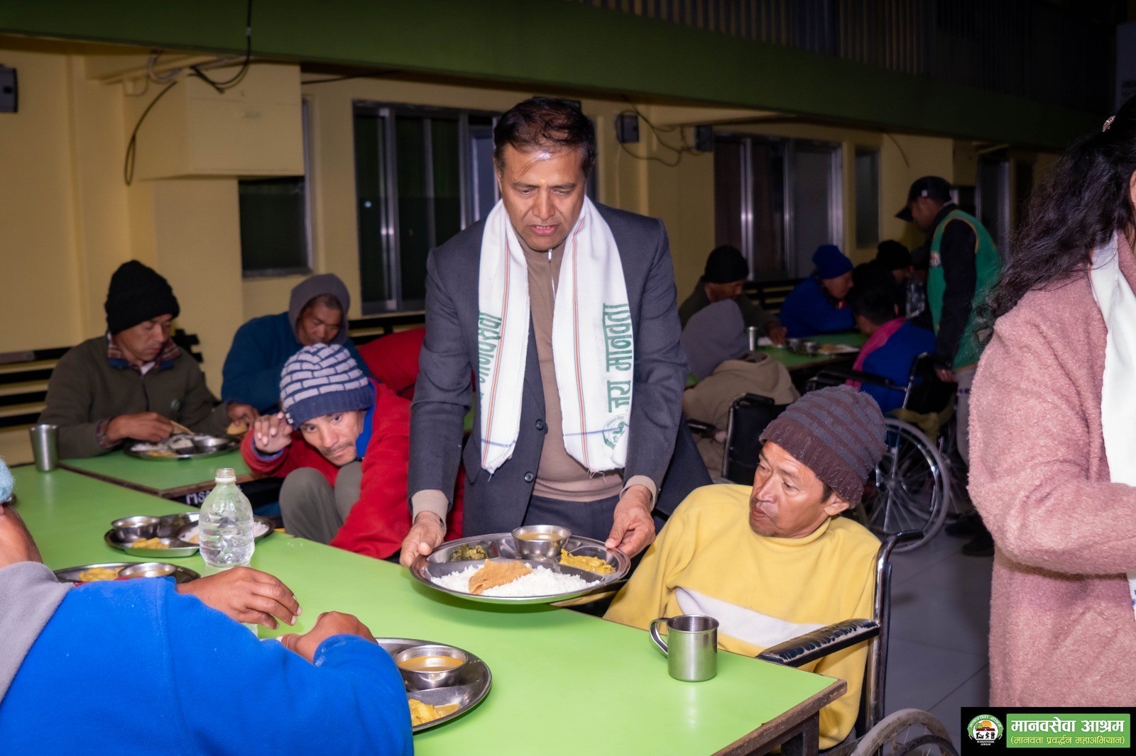Company donation event showing volunteers serving seniors