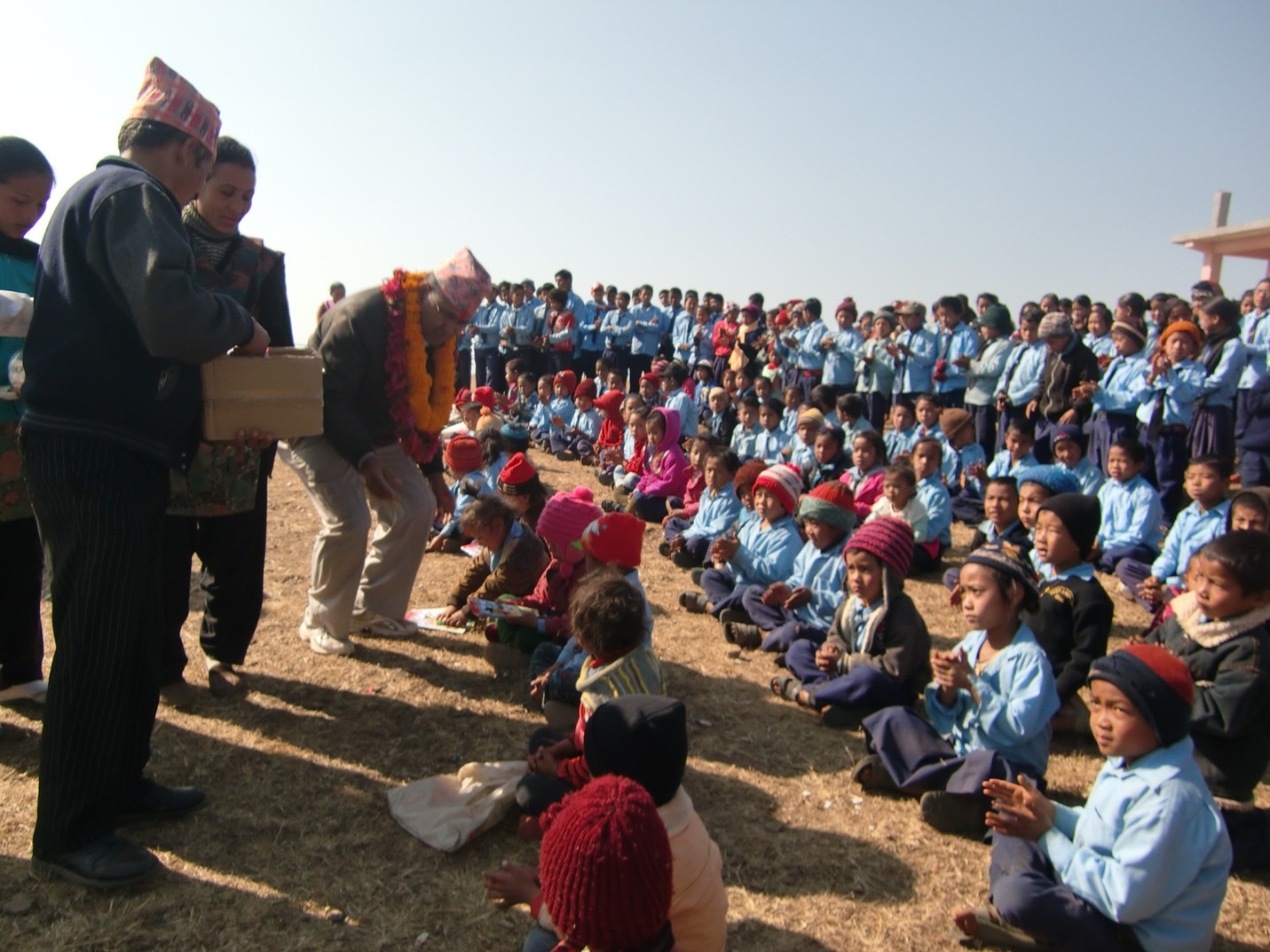 Company donation event showing volunteers serving seniors