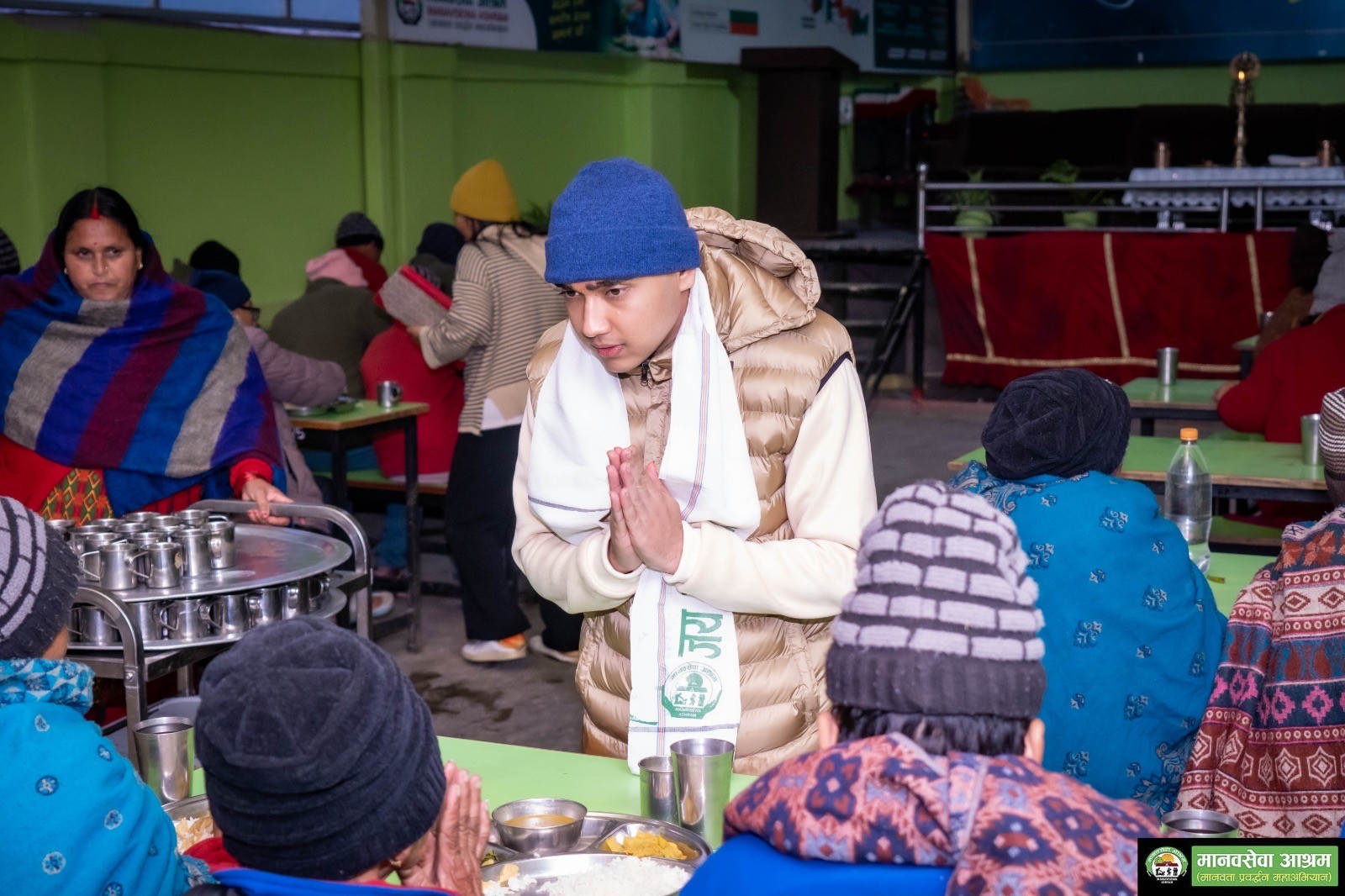 Company donation event showing volunteers serving seniors