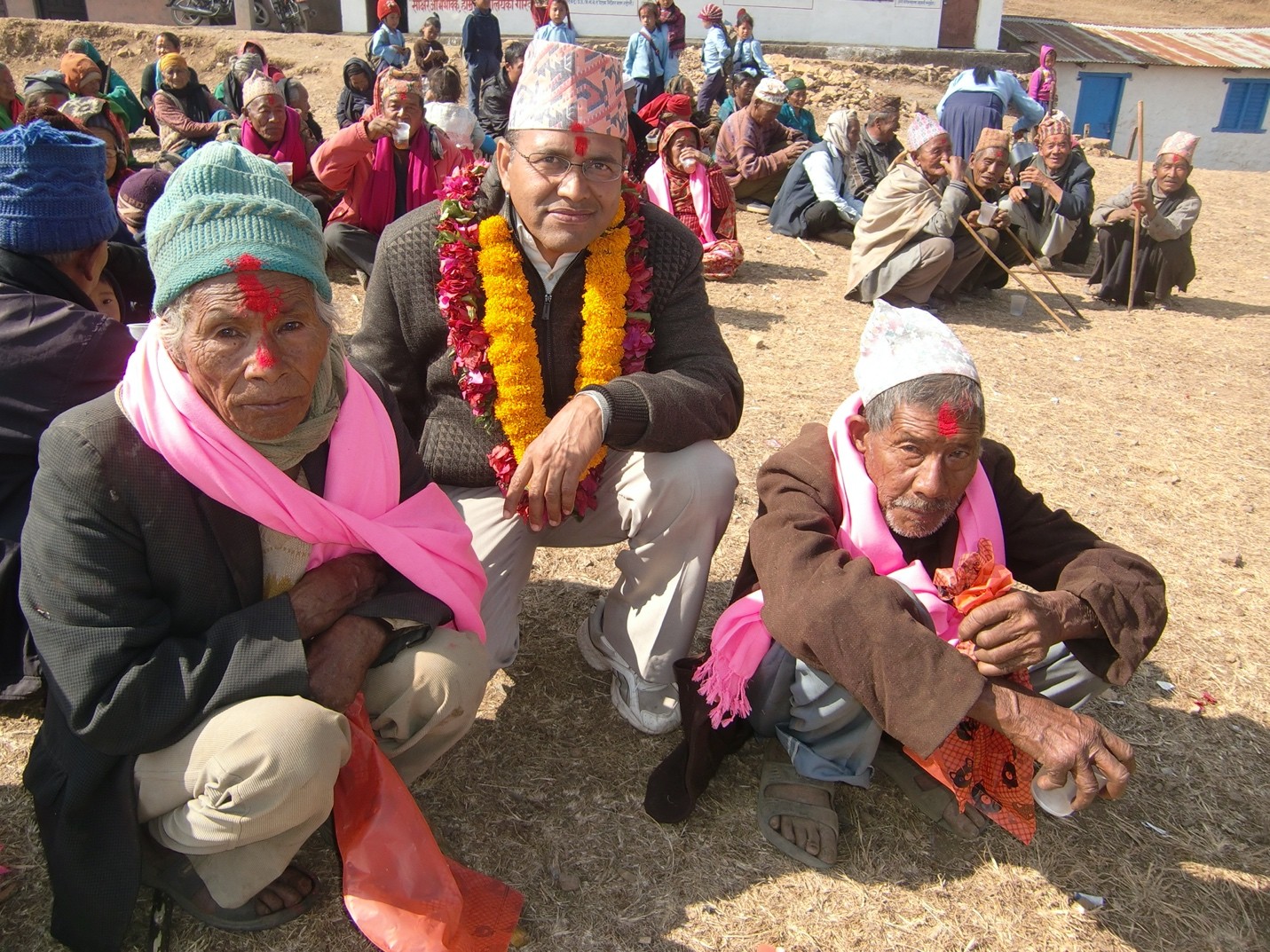 Company donation event showing volunteers serving seniors